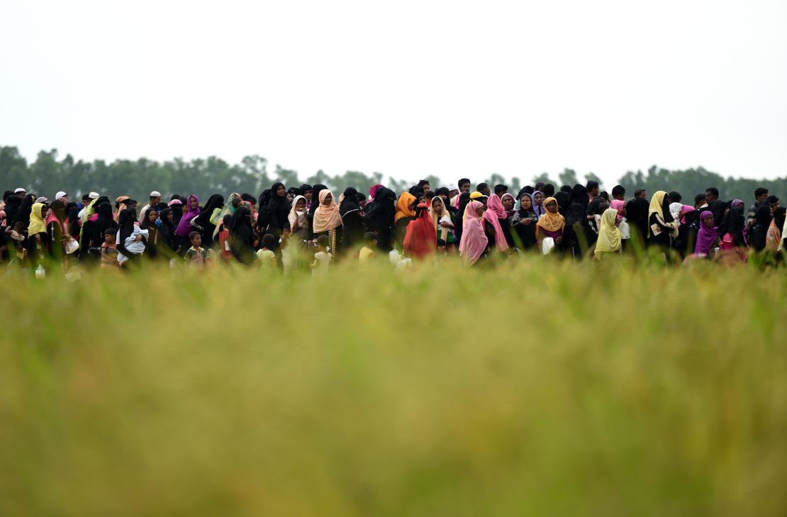 Rohingya refugees wait for relief aid at Nayapara camp in Teknaf near the Bangladesh-Myanmar border on October 21.