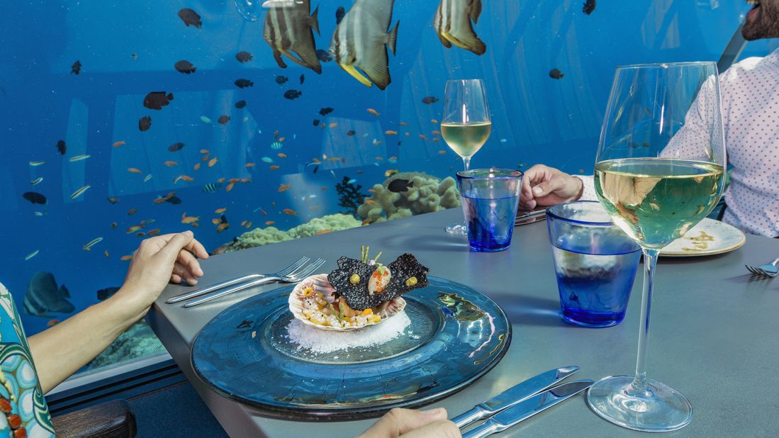 <strong>Happy diners: </strong>German chef Bjoern van den Oever is the man behind 5.8 Undersea Restaurant's dishes.  "I became a chef because I wanted to make people happy," he says. "And with a restaurant like this, it's very easy."