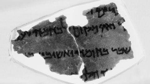 A fragment from the Museum of the Bible's collection of Dead Sea Scrolls. In this fragment, a snippet of text from the Book of Nehemiah, some scholars say they see an annotation from a 1937 edition of the Hebrew Bible, an obvious anachronism. The mark, which looks like a bitten apple, is on the far left of the third line of text.