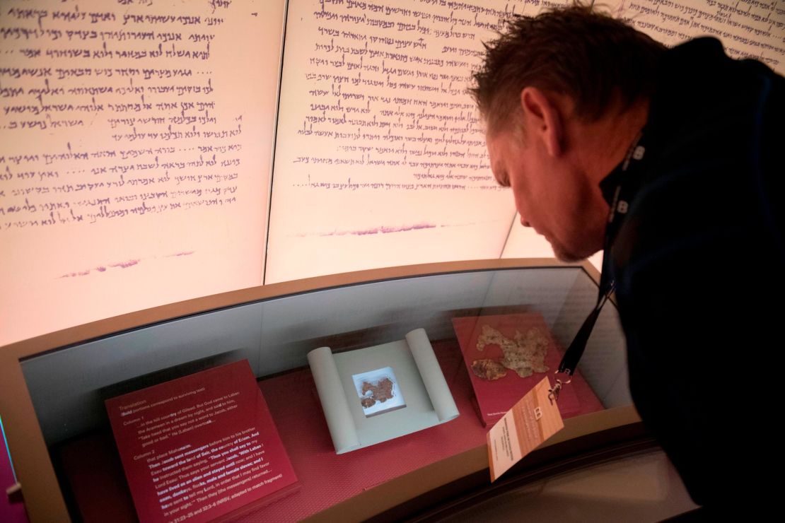 Visitors look at an exhibit about the Dead Sea scrolls at the Museum of the Bible in Washington, DC, on November 14, 2017.