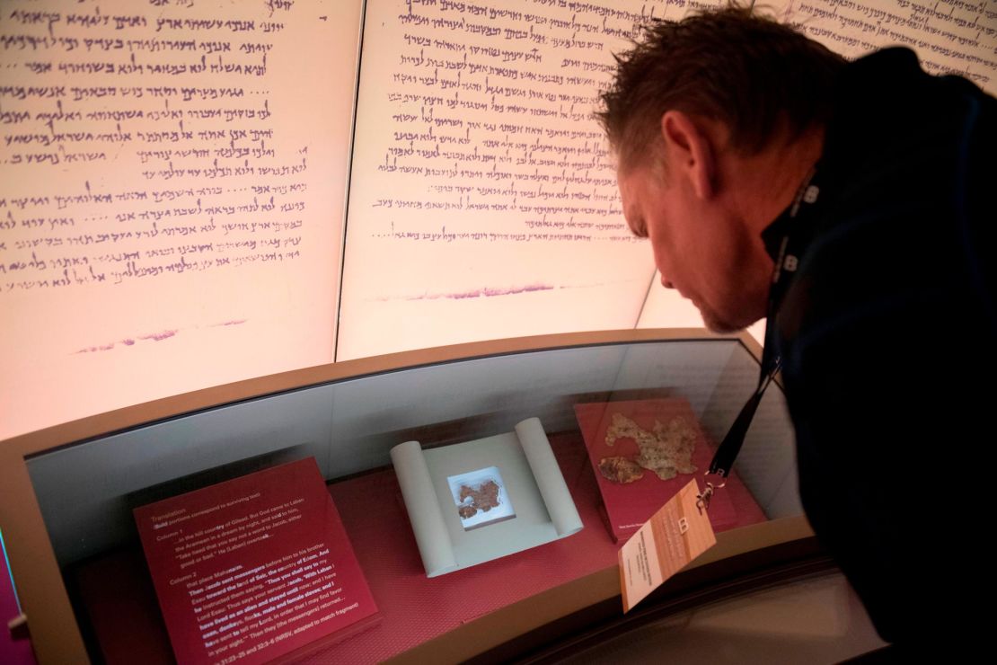 Visitors look at an exhibit about the Dead Sea scrolls at the Museum of the Bible in Washington, DC, on November 14, 2017. 