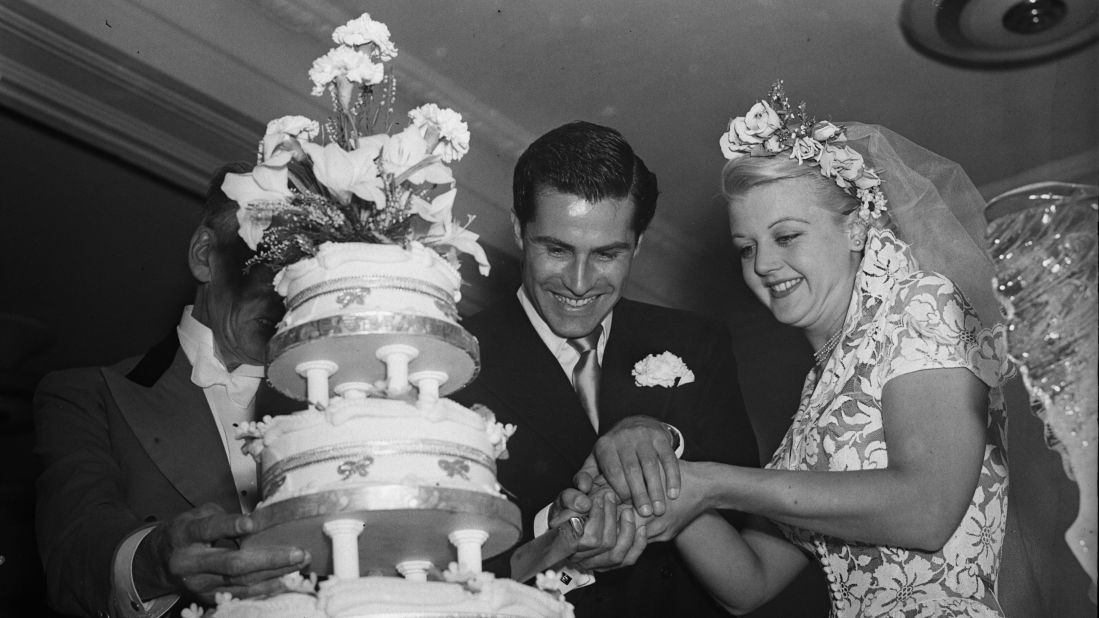 Lansbury and her second husband, actor Peter Shaw, cut the cake at their wedding in 1949. Lansbury was briefly married to Richard Cromwell before divorcing after less than a year. She and Shaw were married until his death in 2003.