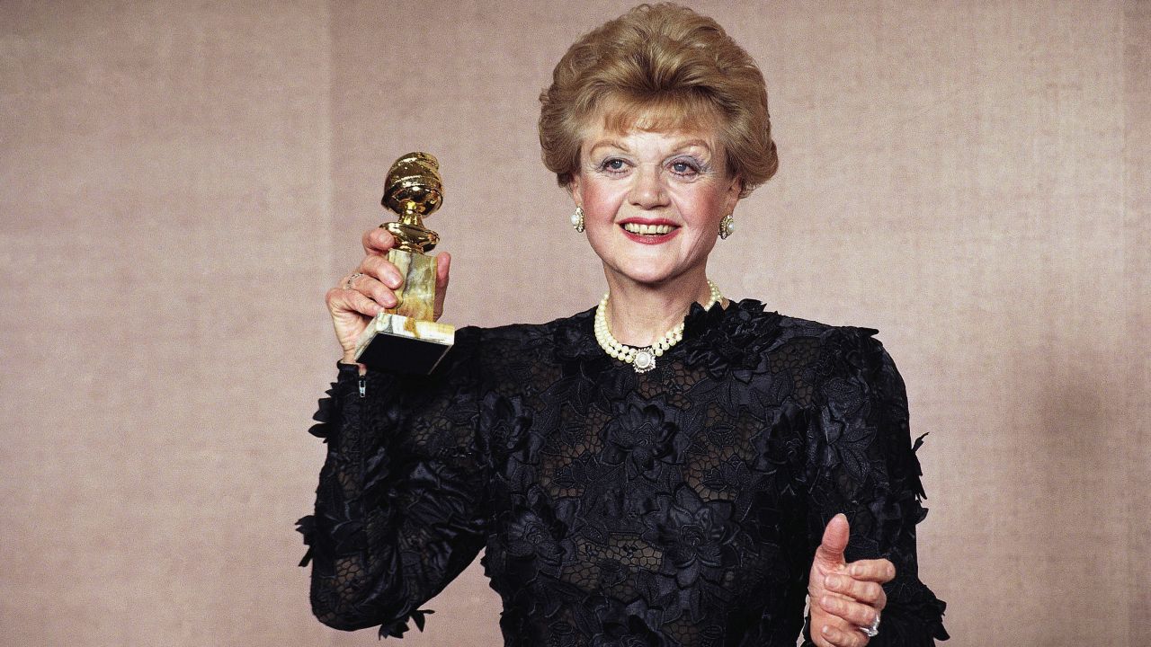 Lansbury holds up the Golden Globe she won in 1990 for her role in "Murder, She Wrote."