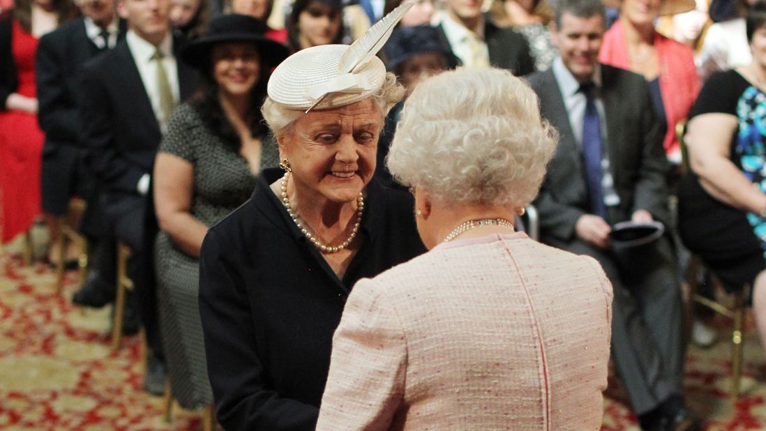 In 2014, Lansbury was formally invested as a dame by Britain's Queen Elizabeth II.