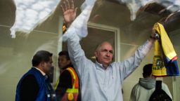 The mayor of Caracas, Antonio Ledezma, 62, greets followers at El Dorado International Airport in Bogota, Colombia, on November 17, 2017, before embarking to Spain after escaping house arrest in the Venezuelan capital. 