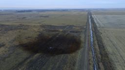 This aerial photo shows spills from TransCanada Corp.'s Keystone pipeline, Friday, Nov. 17, 2017, that leaked an estimated 210,000 gallons of oil onto agricultural land in northeastern South Dakota, near Amherst, S.D., the company and state regulators said Thursday, but state officials don't believe the leak polluted any surface water bodies or drinking water systems. Crews shut down the pipeline Thursday morning and activated emergency response procedures after a drop in pressure was detected resulting from the leak south of a pump station in Marshall County, TransCanada said in a statement. The cause was being investigated. (DroneBase via AP)