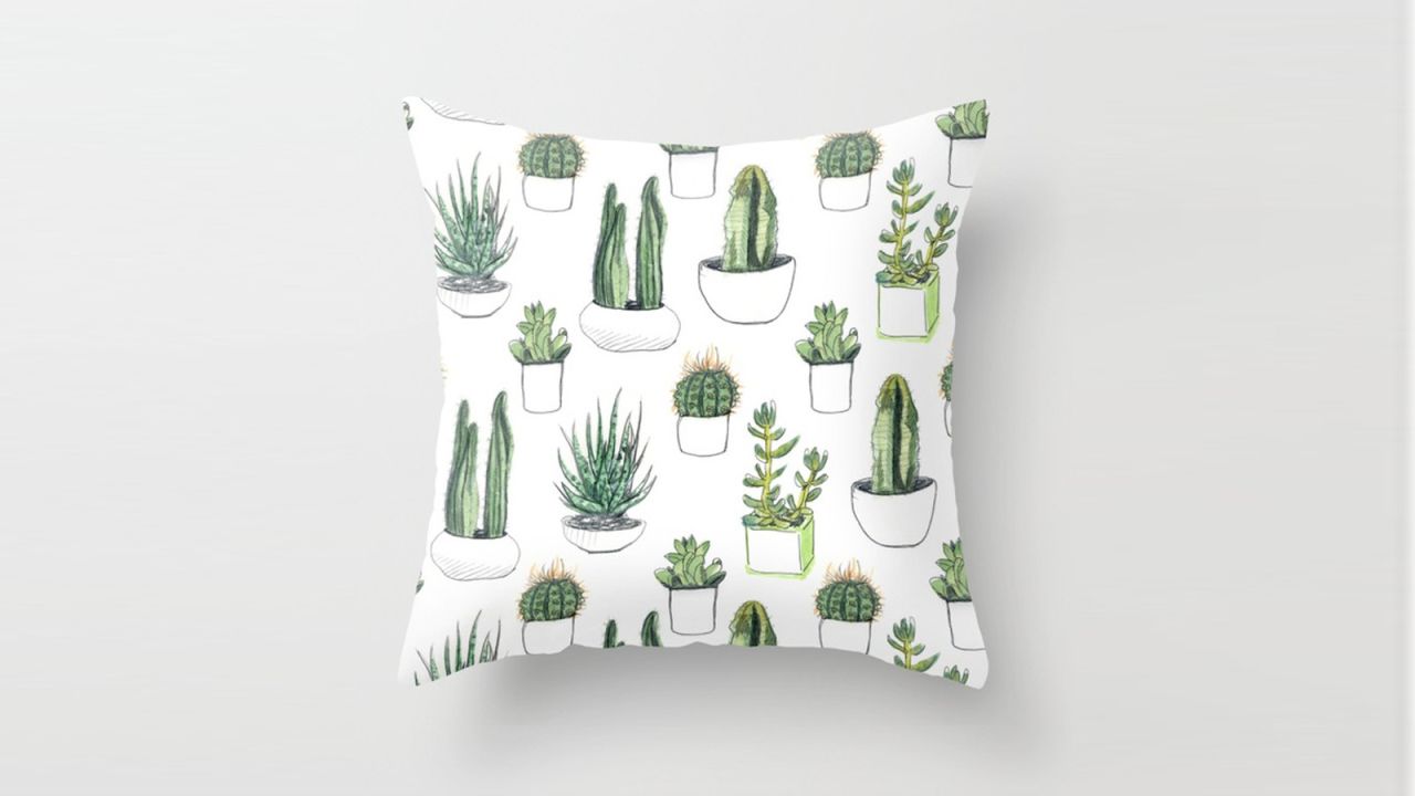 <strong>V: Vicky Webb Throw Pillow ($22.49; </strong><a href="http://www.anrdoezrs.net/links/8314883/type/dlg/sid/1217azgiftguide/https://society6.com/product/watercolour-cacti-and-succulent_pillow?sku=s6-2410254p26a18v129a25v193" target="_blank" target="_blank"><strong>society6.com</strong></a><strong>) </strong>
