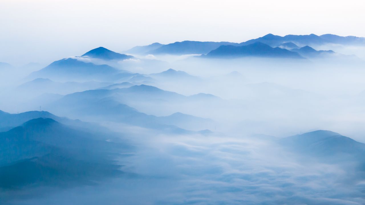 This view to the north-east over Lake Yamanakako covered in mist, was photographed by Peacock from the summit of Mount Fuji.