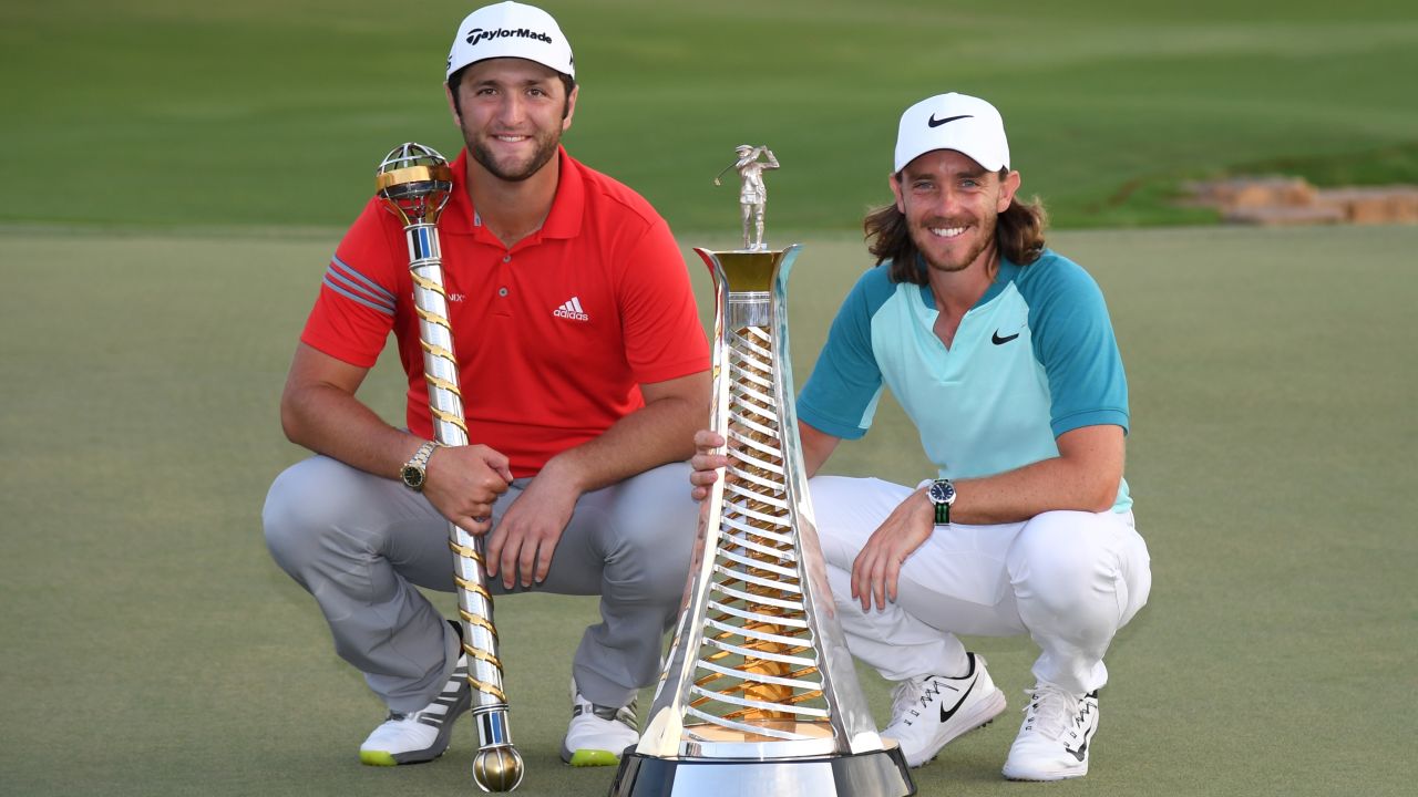 DUBAI, UNITED ARAB EMIRATES - NOVEMBER 19:  Jon Rahm of Spain poses with the trophy and Tommy Fleetwood of England poses with the Race to Dubai trophy during the final round of the DP World Tour Championship at Jumeirah Golf Estates on November 19, 2017 in Dubai, United Arab Emirates.  (Photo by Ross Kinnaird/Getty Images)
