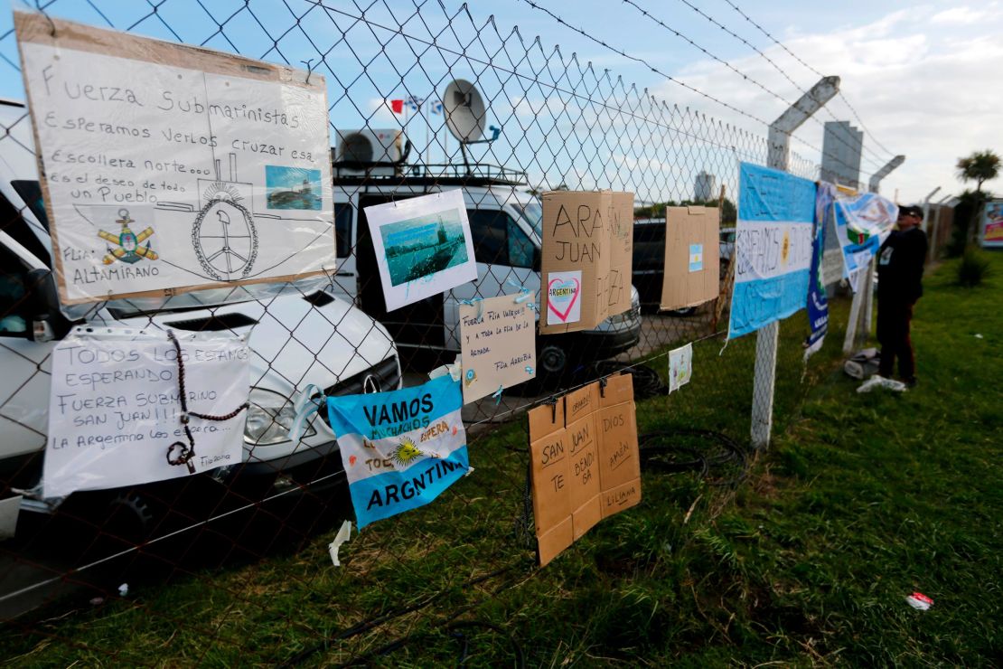 Messages of support for the crew of the San Juan hang from the fence at the naval base in Mar del Plata, Argentina.