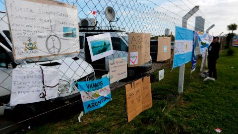 Messages of support for the crew of the San Juan hang from the fence at the naval base in Mar del Plata, Argentina.