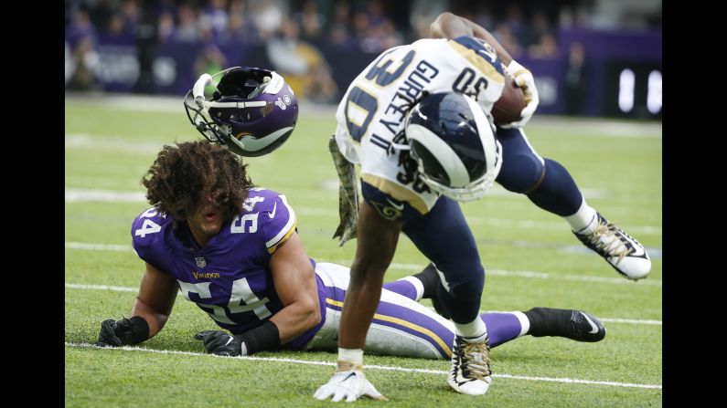 Minnesota linebacker Eric Kendricks loses his helmet as he chases Los Angeles Rams running back Todd Gurley during an NFL game in Minneapolis on Sunday, November 19.