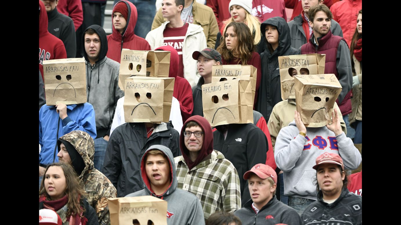 Arkansas fans wear paper bags over their heads in the final seconds of a football loss to Mississippi State on Saturday, November 18. Arkansas' record dropped to 4-7 on the season.