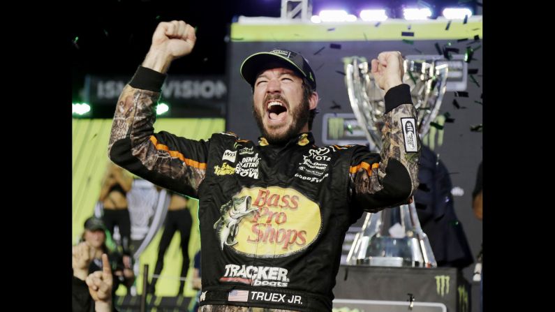 Martin Truex Jr. celebrates after winning the NASCAR Cup Series title on Sunday, November 19. It is his first championship on NASCAR's top circuit.