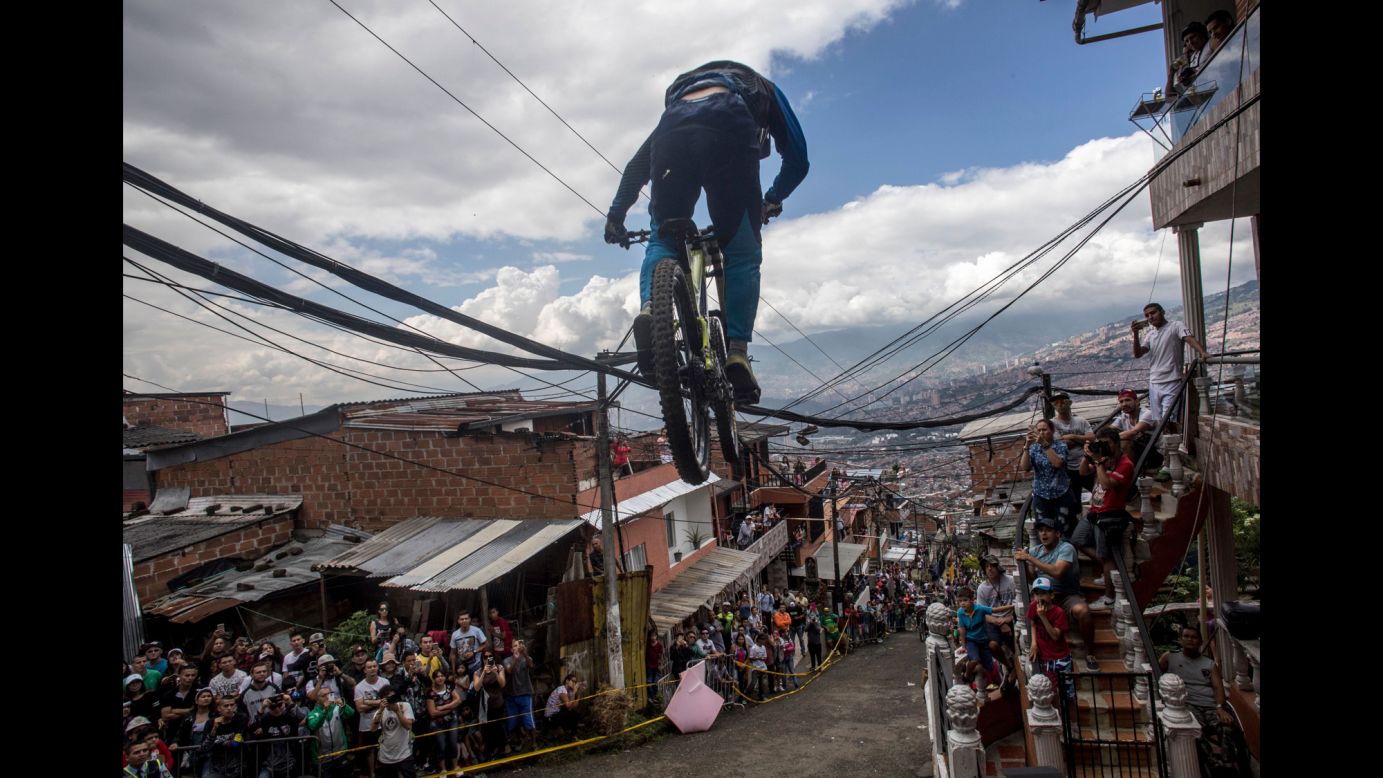 A cyclist races downhill during a bike race in Medellin, Colombia, on Sunday, November 19.