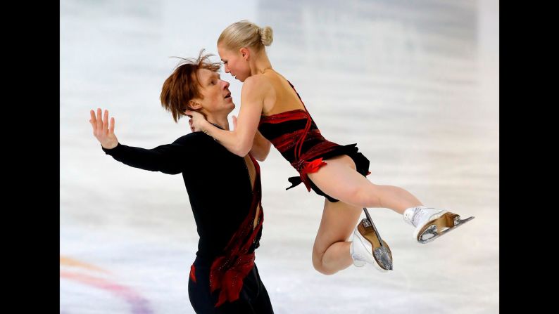 Russian figure skaters Vladimir Morozov and Evgenia Tarasova perform their short program during the Grand Prix event in Grenoble, France, on Friday, November 17. They won gold in the pairs competition.