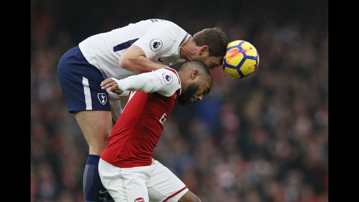 Tottenham's Jan Vertonghen, top, and Arsenal's Alexandre Lacazette compete for a header during a Premier League match in London on Saturday, November 18. Arsenal won the rivalry match 2-0.