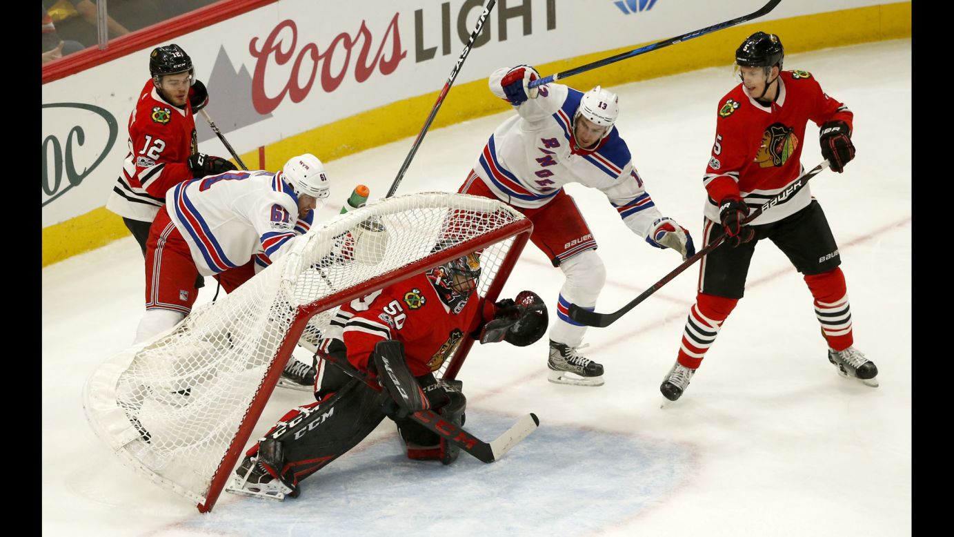 The net almost falls onto Chicago goalie Corey Crawford during an NHL game against the New York Rangers on Wednesday, November 15.