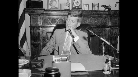 In this image taken in his Senate office in January 1955, Kennedy is suffering from ramifications of his October 1954 spinal implant designed to fuse his spine and relieve his pain. An infection kept the incision from healing, creating an "open, gaping ... hole," according to his speechwriter. The implant was removed in February.