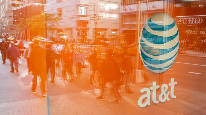 An AT&T store is seen on 5th Avenue in New York on October 23, 2016. 
AT&T unveiled a mega-deal for Time Warner that would transform the telecom giant into a media-entertainment powerhouse positioned for a sector facing major technology changes. The stock-and-cash deal is valued at $108.7 billion including debt, and gives a value of $84.5 billion to Time Warner -- a major name in the sector that includes the Warner Bros. studios in Hollywood and an array of TV assets such as HBO and CNN. / AFP / KENA BETANCUR        (Photo credit should read KENA BETANCUR/AFP/Getty Images)