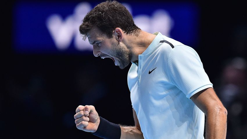 Bulgaria's Grigor Dimitrov reacts after winning the first set against Belgium's David Goffin during their men's singles final match on day eight of the ATP World Tour Finals tennis tournament at the O2 Arena in London on November 19, 2017. / AFP PHOTO / Glyn KIRK        (Photo credit should read GLYN KIRK/AFP/Getty Images)