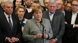 BERLIN, GERMANY - NOVEMBER 20:  German Chancellor and leader of the German Christian Democrats (CDU) Angela Merkel, standing with leading members of her party, speaks to the media in the early hours after preliminary coalition talks collapsed following 
the withdrawal of the Free Democratic Party (FDP) 
on November 20, 2017 in Berlin, Germany. The German Christian Democrats (CDU), its sister party the Bavarian Christian Democrats (CSU), the Free Democratic Party (FDP) and the Greens Party (Buendnis 90/Die Gruenen) had been slogging through three weeks of difficult talks that ended today when the FDP announced it could not find sufficient common ground with the other parties. The situation now makes the next German government uncertain.  (Photo by Sean Gallup/Getty Images)