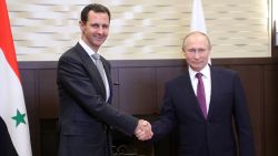 Russia's President Vladimir Putin (R) shakes hands with his Syrian counterpart Bashar al-Assad during a meeting in Sochi on November 20, 2017. / AFP PHOTO / SPUTNIK / Mikhail KLIMENTYEV        (Photo credit should read MIKHAIL KLIMENTYEV/AFP/Getty Images)