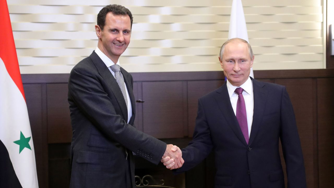 Russia's President Vladimir Putin, right, shakes hands with his Syrian counterpart Bashar al-Assad during a meeting in Sochi, Russia, in November.