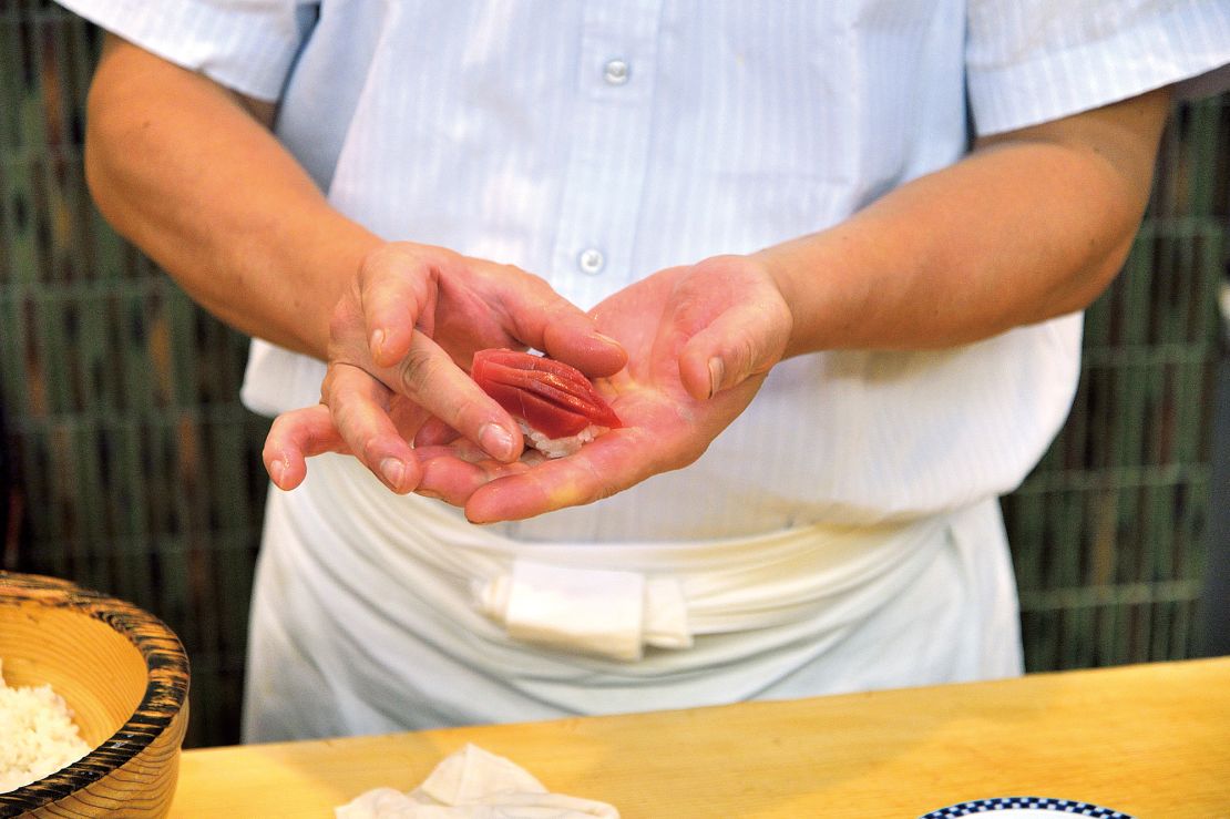 A chef prepares sushi.