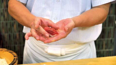A chef prepares sushi.