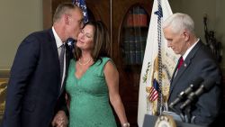 Interior Secretary Ryan Zinke, left, kisses his wife Lolita Hand after Vice President Mike Pence, right, administers the oath of office, Wednesday, March 1, 2017, in the Eisenhower Executive Office Building on the White House complex in Washington. 