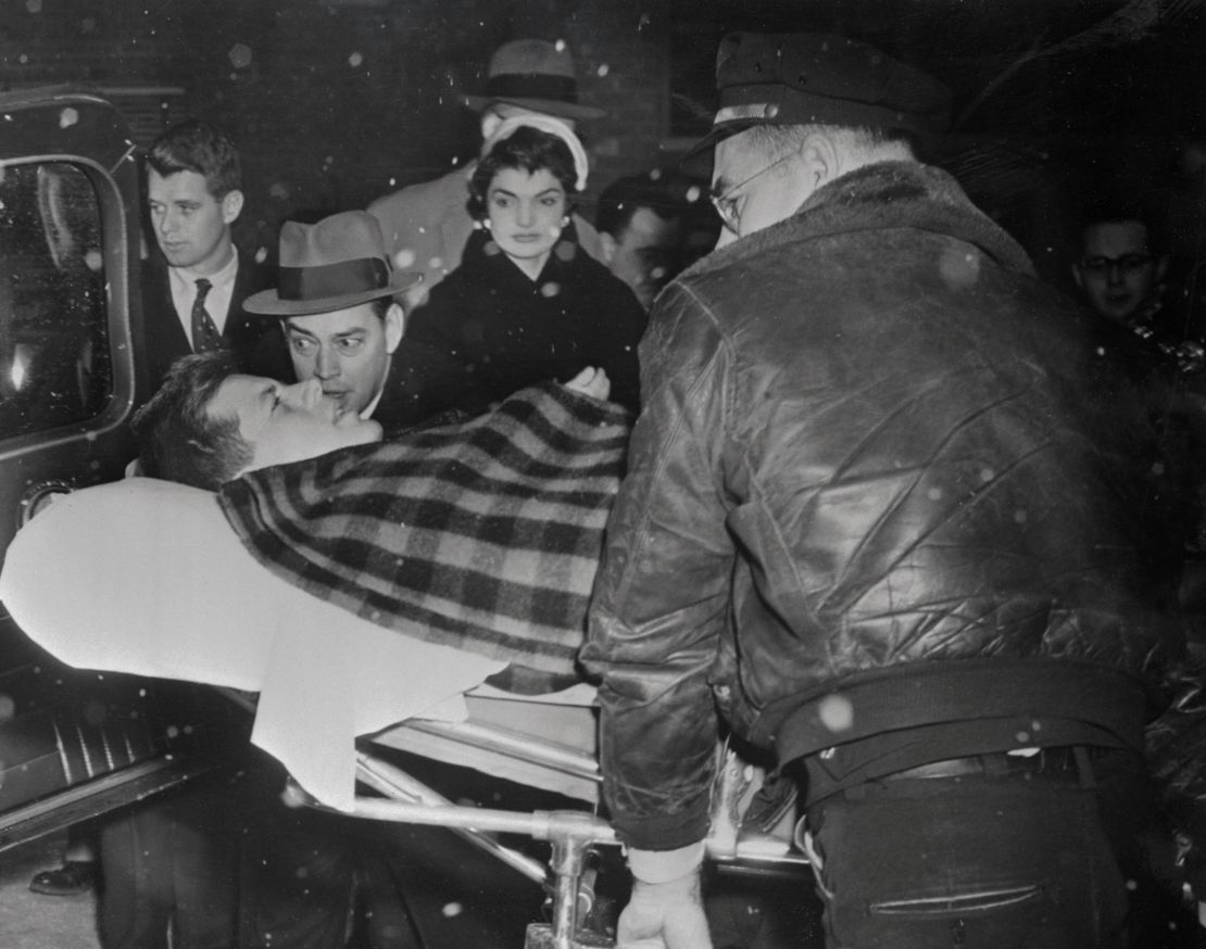 John F. Kennedy and wife Jackie leaving the hospital two months after his 1954 spinal fusion.