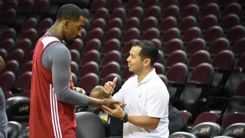 Cavaliers guard J.R. Smith (L) gets his hand checked by trainer Mike Mancias in practice during the 2016 NBA Finals.