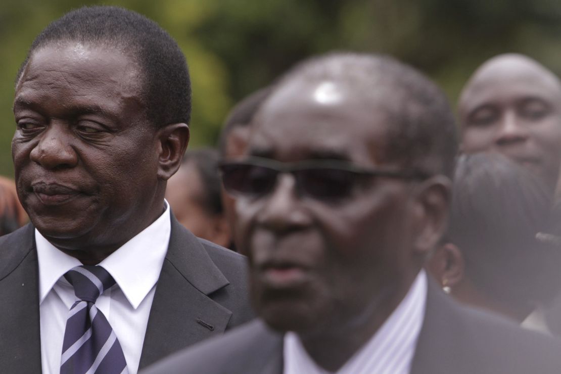 Emmerson Mnangagwa, left, served as a close aide to former leader Robert Mugabe, right.