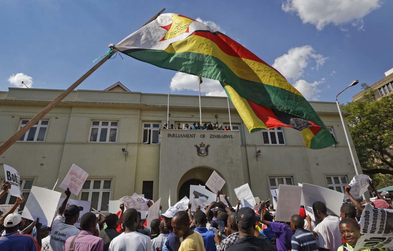 Demonstrators protest outside the Parliament building on November 21.