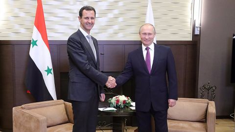 Putin (right) praised Assad for his work fighting ISIS.