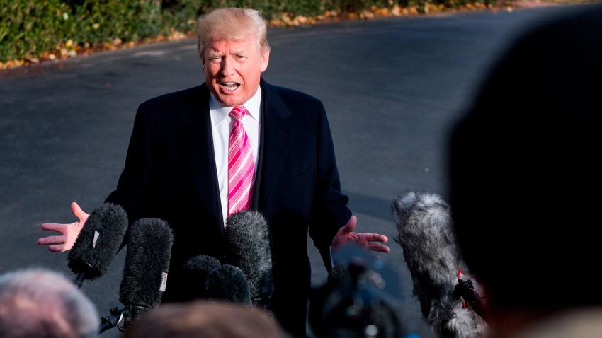 US President Donald Trump talks to reporters during his departure at the White House in Washington, DC, on November 21, 2017. / AFP PHOTO / JIM WATSON        (Photo credit should read JIM WATSON/AFP/Getty Images)
