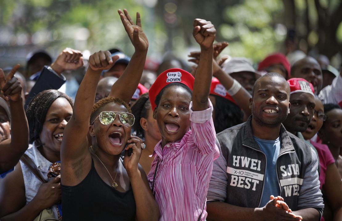 Protesters calling for Mugabe's impeachment demonstrate outside Parliament on Tuesday. 