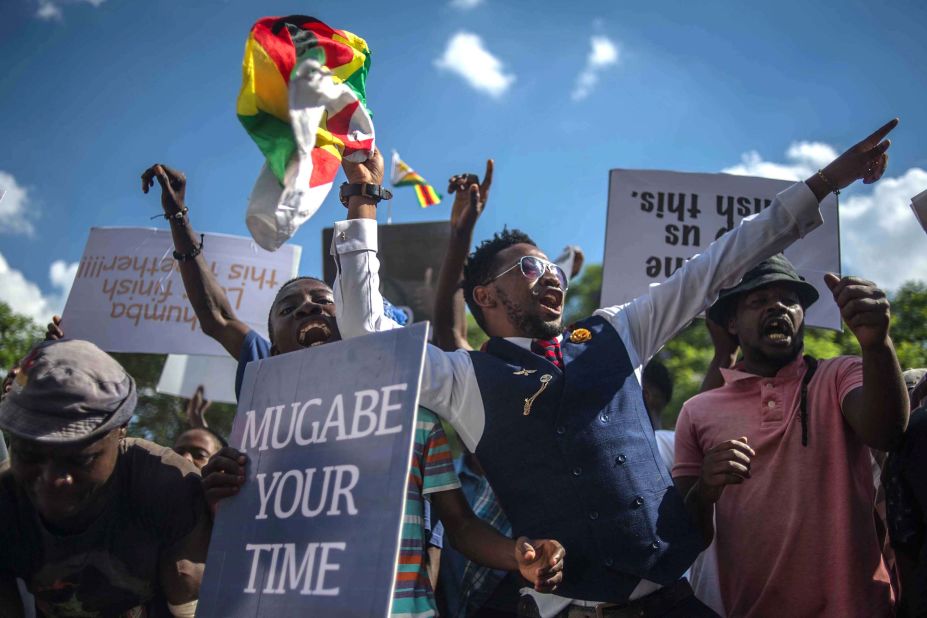 Protesters call for Mugabe's impeachment near the Parliament building in Harare on November 21.