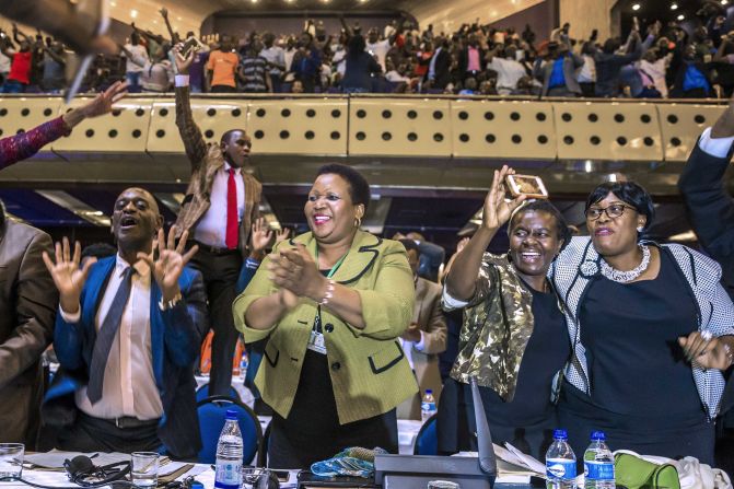 Members of Zimbabwe's Parliament celebrate after the resignation of longtime President Robert Mugabe was announced on Tuesday, November 21. Mugabe, 93, had led the country for nearly four decades. <a href="index.php?page=&url=http%3A%2F%2Fwww.cnn.com%2F2017%2F11%2F21%2Fafrica%2Frobert-mugabe-resigns-zimbabwe-president%2Findex.html" target="_blank">His resignation</a> comes six days after military leaders seized control of the nation and placed him under house arrest.