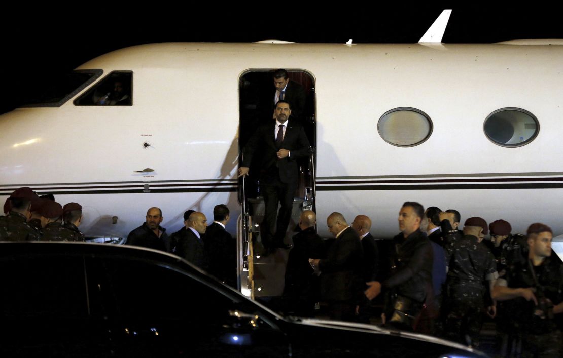 Hariri arrives at the airport in Beirut late Tuesday.  