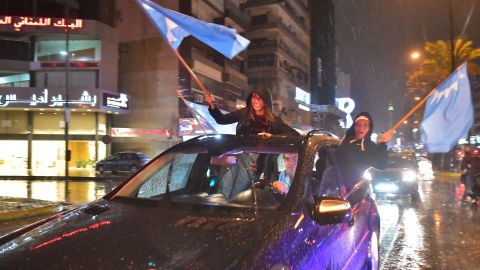 Hariri supporters wave Future Movement flags and celebrate his return on Tuesday.