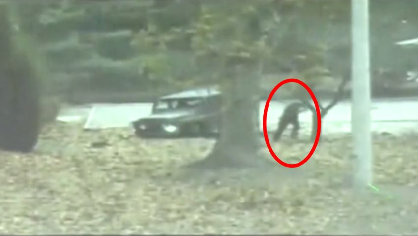 A North Korean defector darts across the DMZ dividing the two Koreas in this screenshot of handout video provided by the United Nations Command.