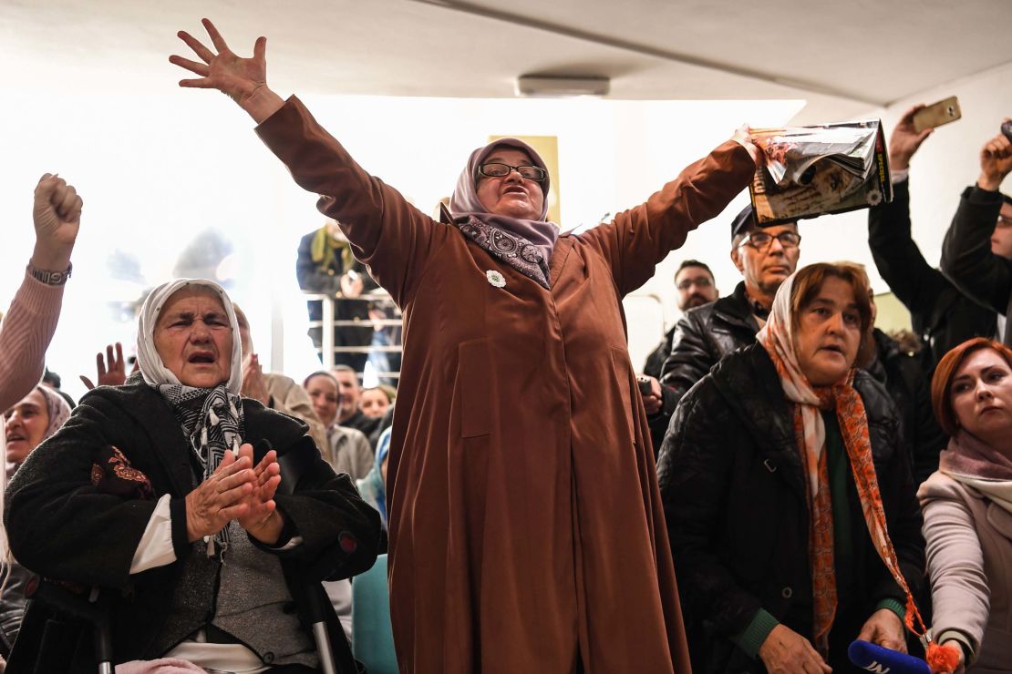 People in Srebrenica celebrate as they watch a live TV broadcast of the trial Wednesday.