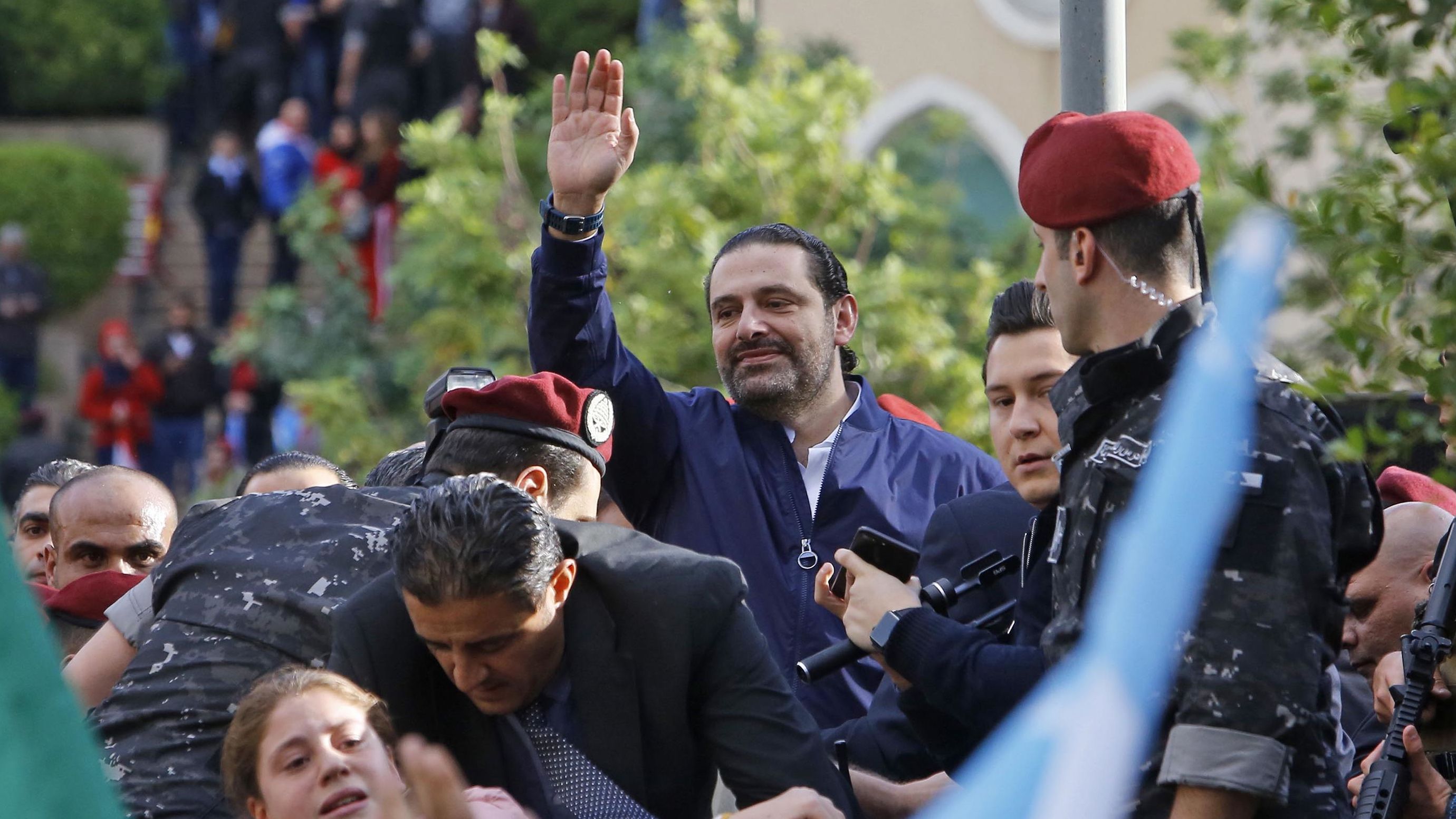 Lebanese Prime Minister Saad Hariri greets his supporters upon arriving at his home in Beirut in November.