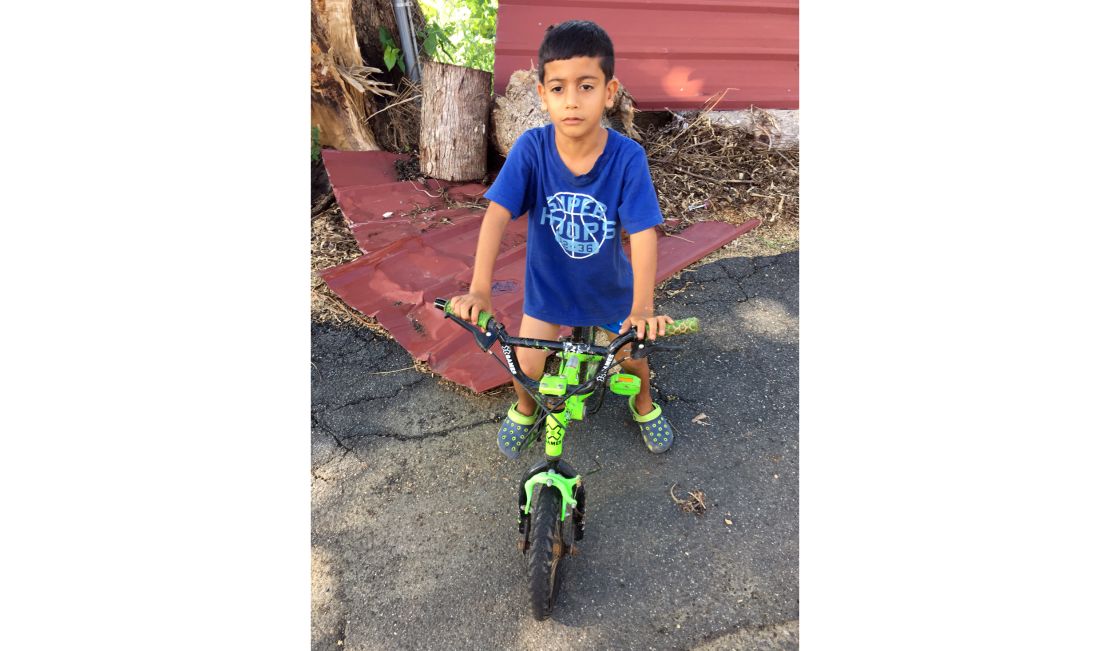 Elian Nieves, 6, gave his donated clothes to friends who were needier.