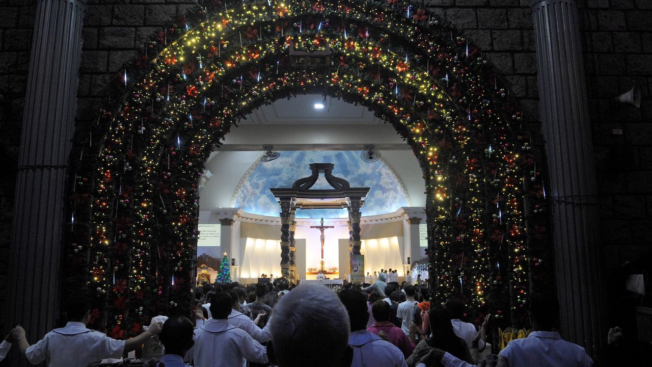 Colorful lights outline the doorway of a Roman Catholic Church in suburban Manila.