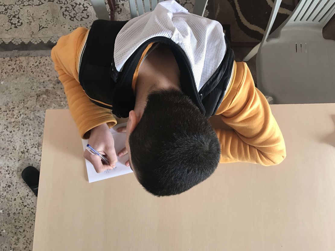 Khalil, a former ISIS child soldier, studies at the rehabilitation center in Aleppo.