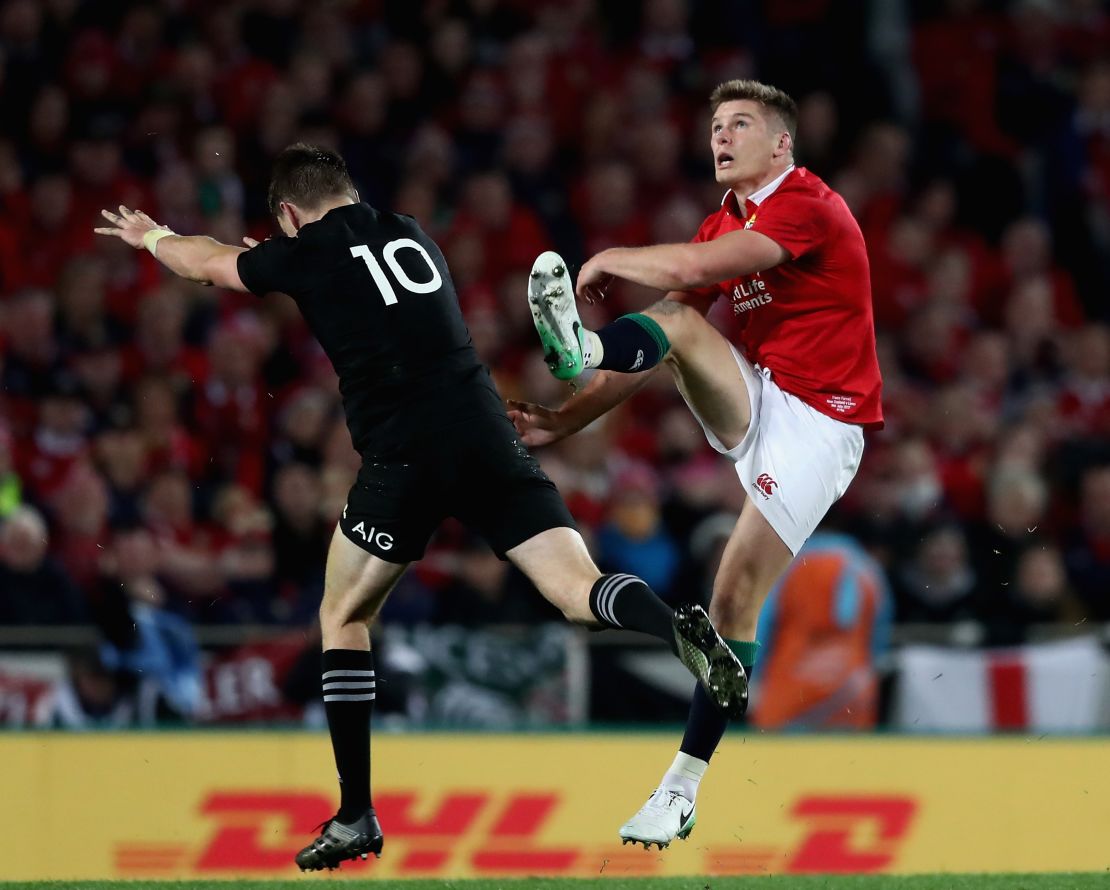 Owen Farrell (right) is put under pressure by New Zealand's Beauden Barrett during the third and final test of this year's Lions Tour.