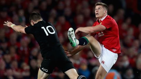 Owen Farrell (right) is put under pressure by New Zealand's Beauden Barrett during the third and final test of this year's Lions Tour.